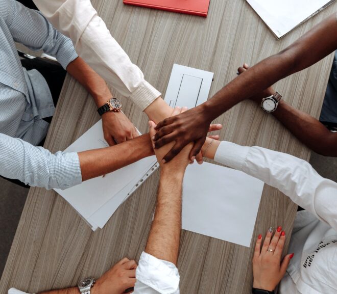 man and woman holding each other s hands as a team