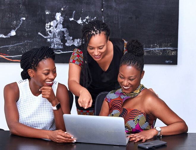 women sitting at a table in the office