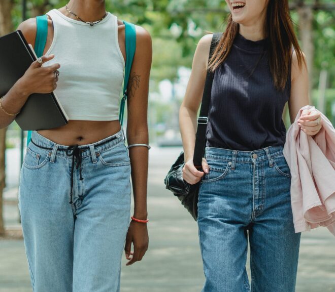 two young women walkng in the street