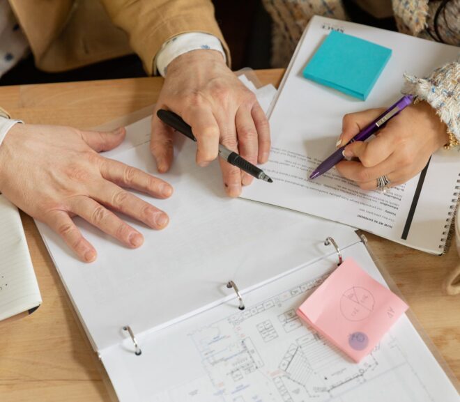 person writing on white paper