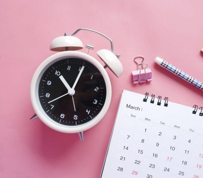 white and pink alarm clock