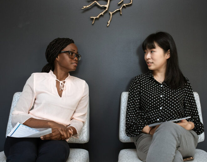22 Things That Should Be on Your Resume. Two Women Sitting on Chairs talking.