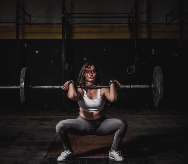 woman lifting barbell