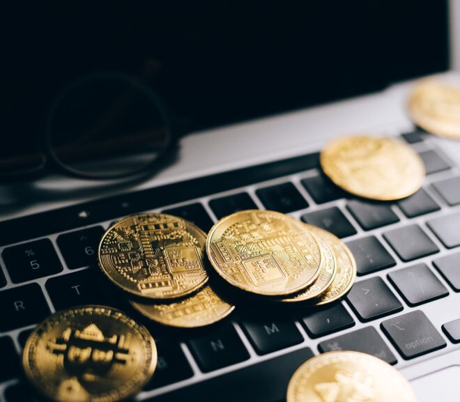 silver round coins on black computer keyboard