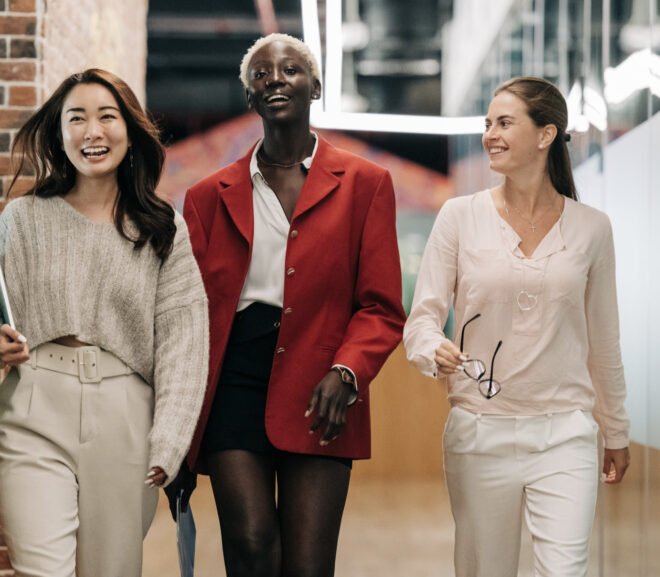 Three successful women walking