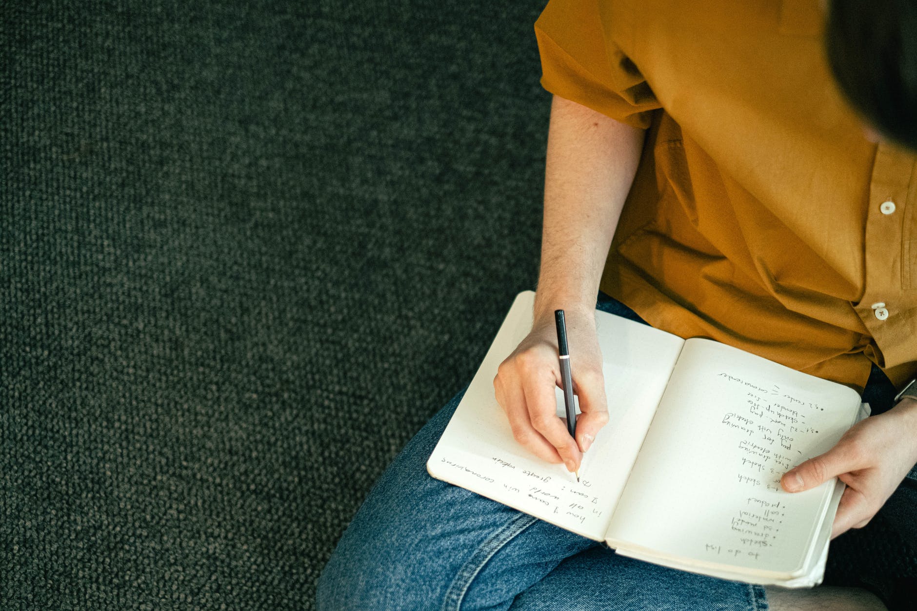 person writing on a notebook, why it's ok to quit