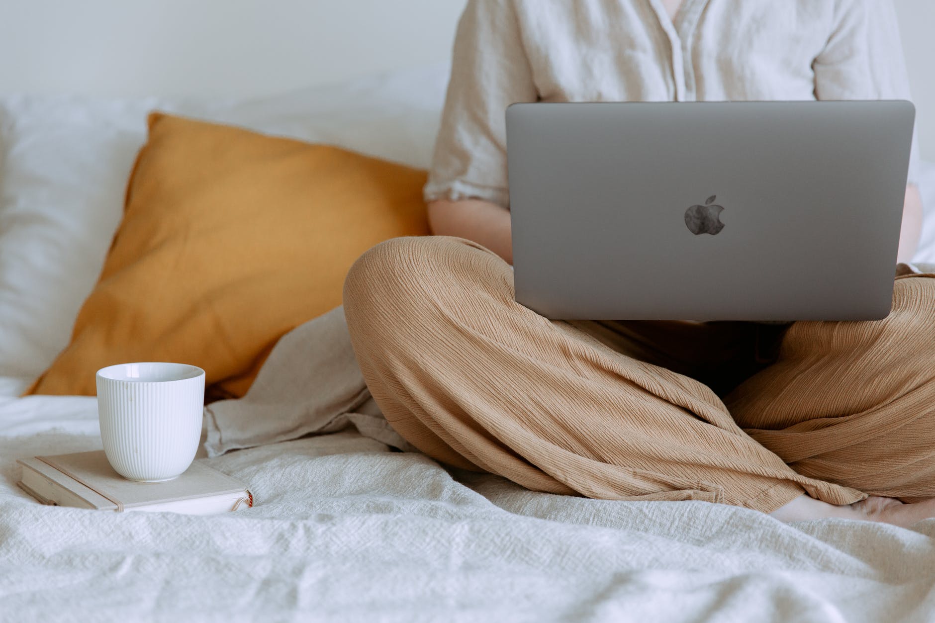 anonymous woman using laptop in bedroom, Why You Can Still Start Your Career in Your Late 20s 